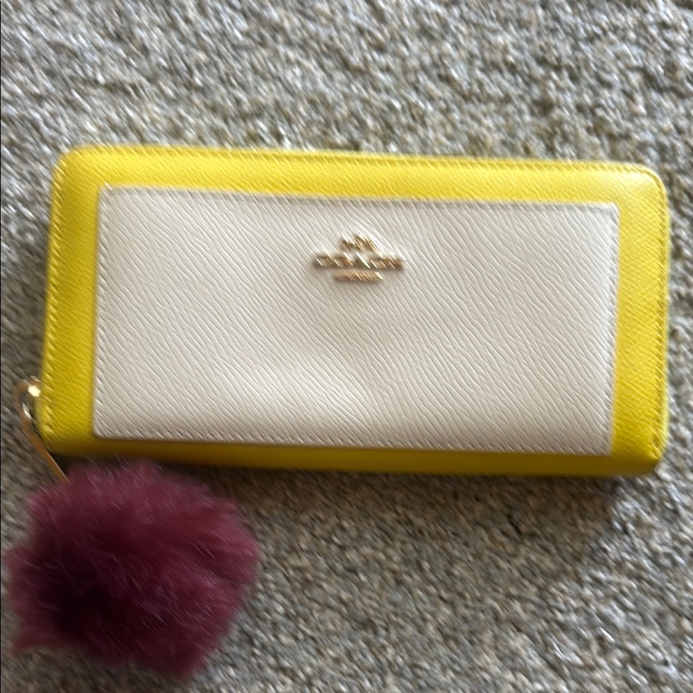 Coach Yellow and White Zip-Around Wallet with Burgundy Pom Pom
